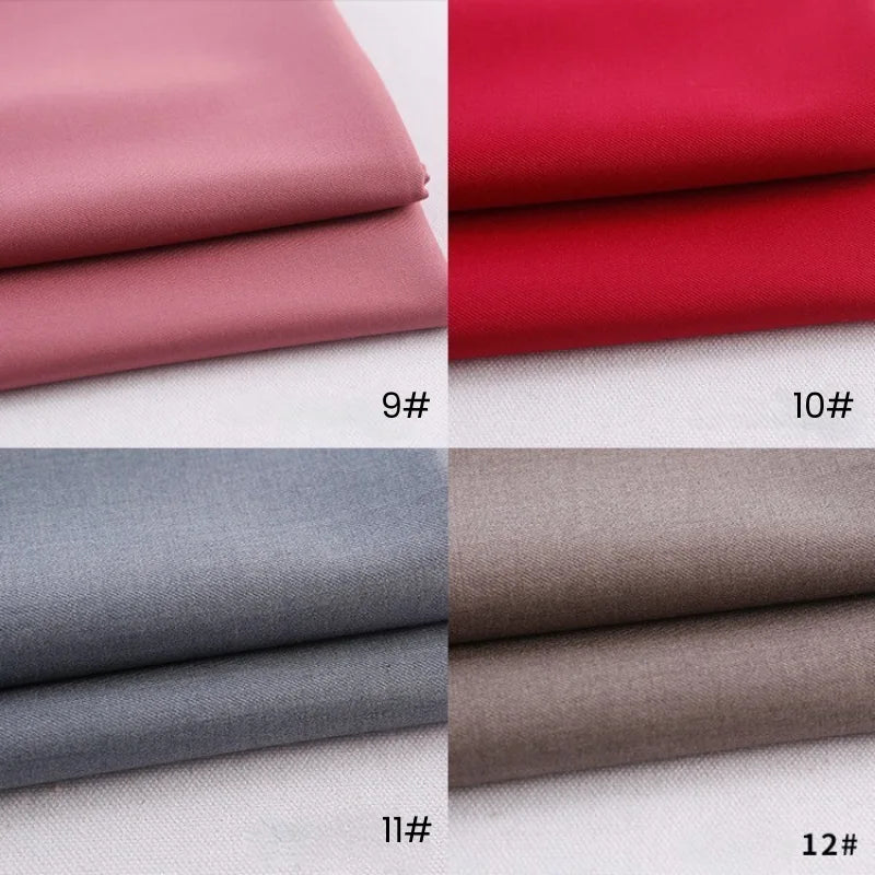 Four folded swatches of Longan Craft Colorful Rayon Polyester Blend Gabardine Fabric—pink (9#), red (10#), light gray (11#), and taupe (12#)—are neatly displayed on a white background.