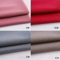 Four folded swatches of Longan Craft Colorful Rayon Polyester Blend Gabardine Fabric—pink (9#), red (10#), light gray (11#), and taupe (12#)—are neatly displayed on a white background.