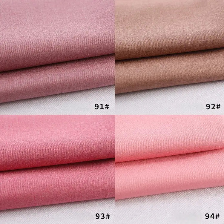 Four stacks of Longan Craft Colorful Rayon Polyester Blend Gabardine Fabric By The Yard in pink and brown shades, labeled 91#, 92#, 93#, and 94#, are displayed neatly in a 2x2 grid—great for DIY uniforms.
