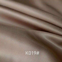 Elegant beige polyester viscose satin fabric with a twill weave and soft sheen by Longan Craft; ideal for formal dresses. "K019#" is printed at the bottom center of the image.