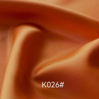 A close-up of Longan Craft's Colorful Satin Viscose Fabric By The Yard highlights the elegant twill weave and vibrant sheen, making this polyester viscose material perfect for formal dressmaking.