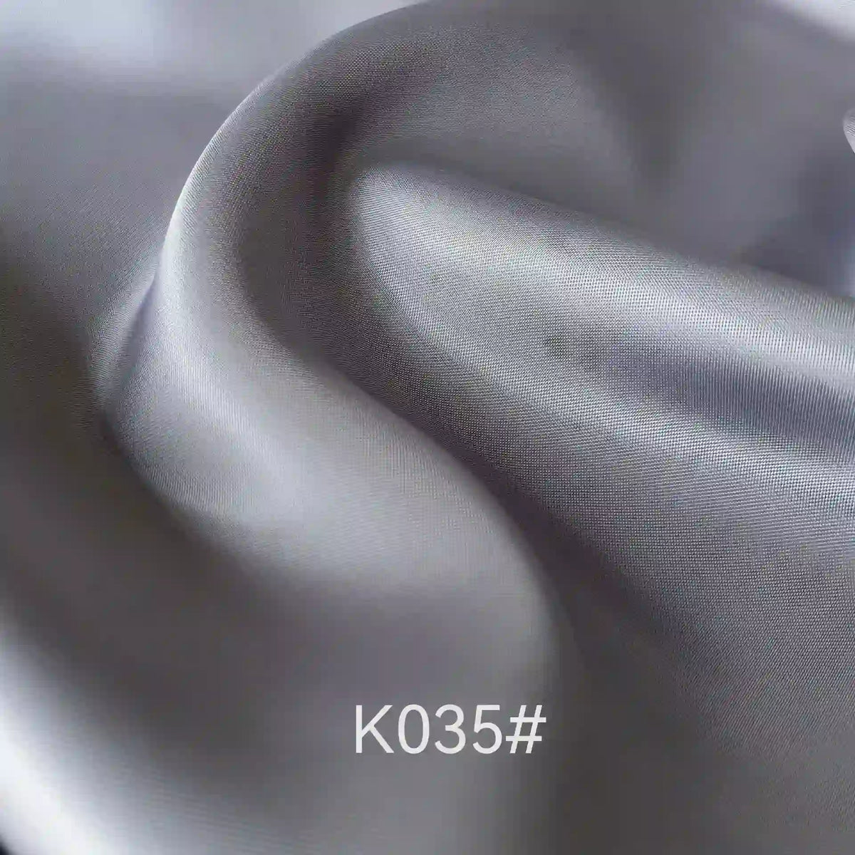 A close-up of Longan Craft's Colorful Satin Viscose Fabric by the yard, featuring a twill weave for a smooth, vibrant sheen—an elegant polyester-viscose material ideal for formal dressmaking projects.