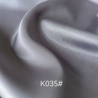 A close-up of Longan Craft's Colorful Satin Viscose Fabric by the yard, featuring a twill weave for a smooth, vibrant sheen—an elegant polyester-viscose material ideal for formal dressmaking projects.