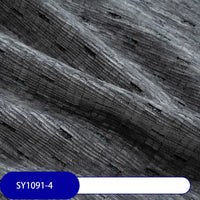 Close-up of Colorful Slub Chenille Fabric by Longan Craft, featuring a gray speckled, corduroy-like ribbed texture with faint rectangles. Blue label shows SY1091-4. Ideal heavyweight chenille material for home decor.