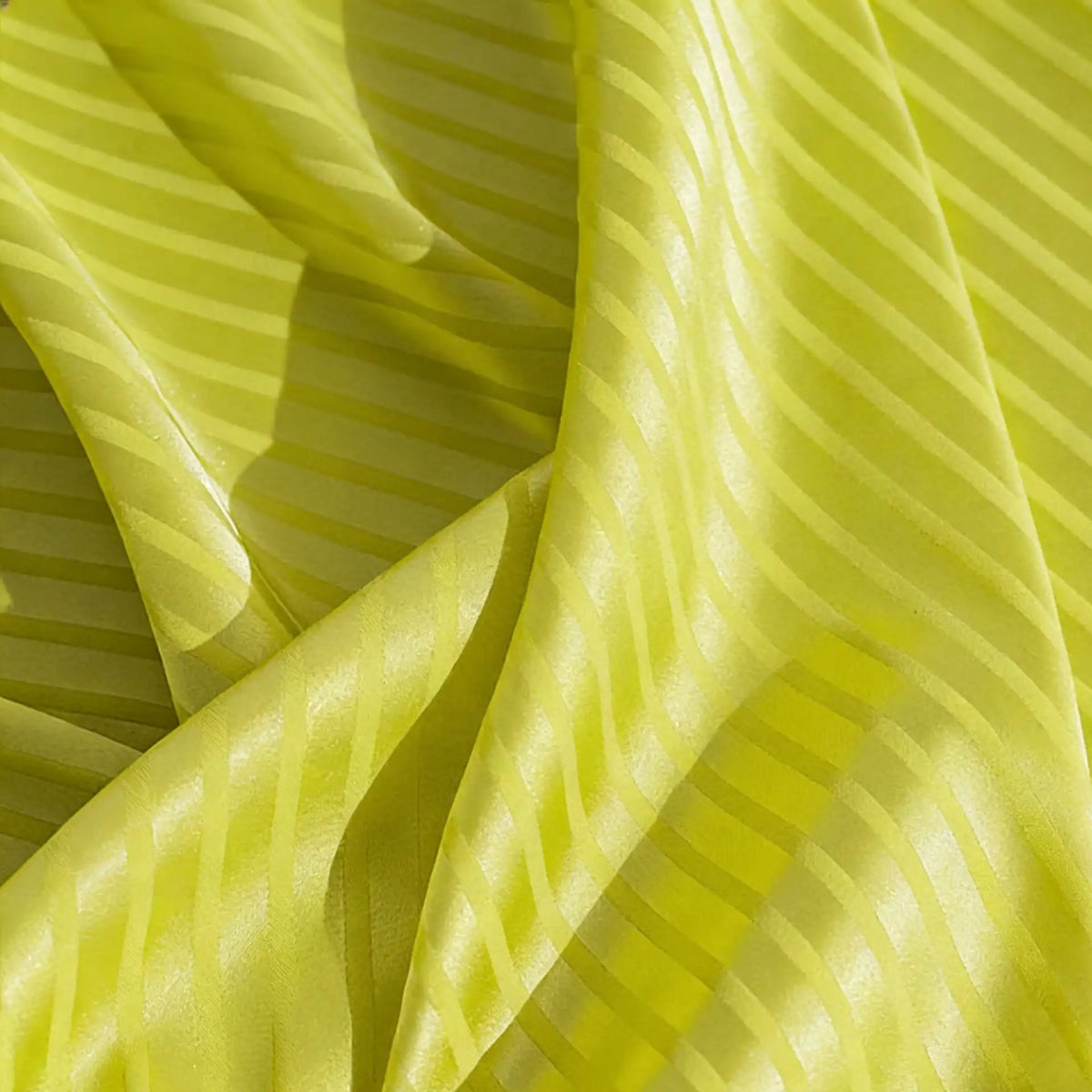 Close-up of Longan Craft’s Colorful Striped Jacquard Satin Fabric by the yard, featuring shiny polyester stripes with a smooth, breathable texture—perfect for dressmaking and highlighting elegant folds and rich gloss.
