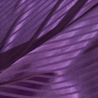 Close-up of Longan Craft’s Colorful Striped Jacquard Satin Fabric by the yard, featuring shiny polyester with diagonal matte and glossy stripes for a textured, wavy look—ideal smooth, breathable material for dressmaking.