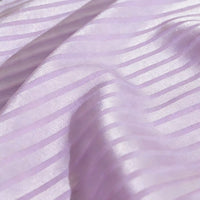 A close-up of Longan Craft's Colorful Striped Jacquard Satin Fabric by the yard, a shiny polyester material with smooth waves and a glossy texture, ideal for dressmaking and highlighting its vibrant stripes.