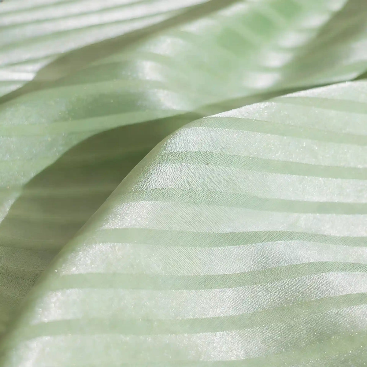 Close-up of Longan Craft's Colorful Striped Jacquard Satin Fabric By The Yard—shiny polyester with smooth, breathable alternating matte and glossy stripes, perfect for elegant dressmaking.