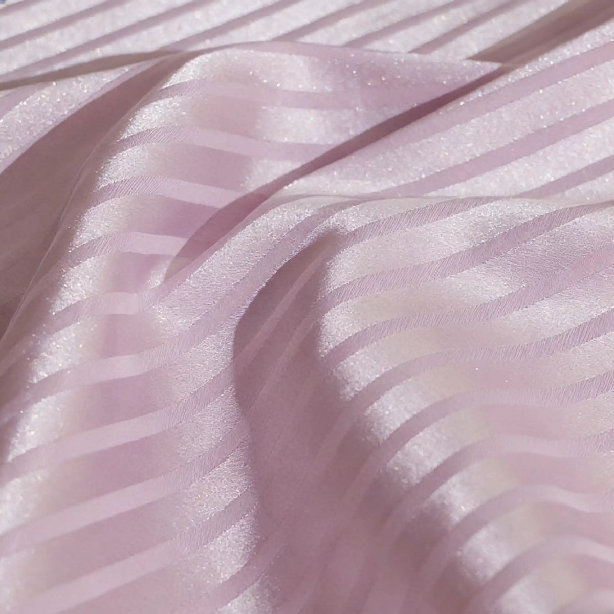 Close-up of Longan Craft's Colorful Striped Jacquard Satin Fabric By The Yard, featuring shiny and matte polyester stripes in a smooth, breathable material—perfect for dressmaking with an elegant, light-reflective texture.