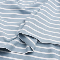 A close-up of Longan Craft’s Colorful Striped Stretch French Terry Fabric shows light blue cotton-spandex knit with evenly spaced white stripes, gently folded to create soft waves—ideal for sweatshirts by the yard.