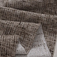 A close-up of Longan Craft's Colorful Tweed Chenille Fabric By The Yard shows its textured woven grid pattern in brown and beige, with a soft chenille surface for clothing and a dotted white backing on the reverse side.