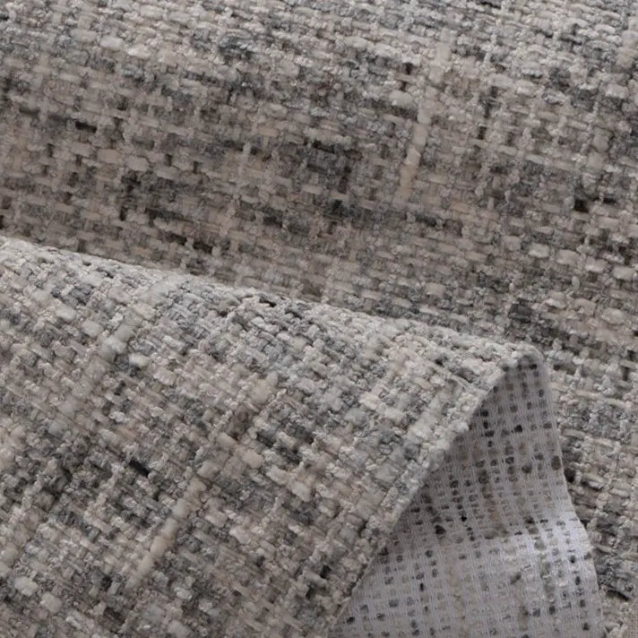 Close-up of Longan Craft’s Colorful Tweed Chenille Fabric by the Yard, a soft, textured woven chenille in gray and white with a grid-like pattern. Slightly folded to show both sides—ideal for clothing and upholstery projects.