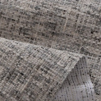 Close-up of Longan Craft’s Colorful Tweed Chenille Fabric by the Yard, a soft, textured woven chenille in gray and white with a grid-like pattern. Slightly folded to show both sides—ideal for clothing and upholstery projects.