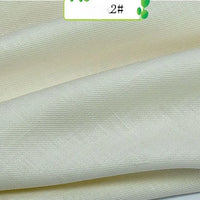 Close-up of Colorful Twill 100 Lyocell Fabric by Longan Craft, showing its smooth off-white surface, subtle diagonal weave, and gentle sheen—a sustainable, comfortable choice for suits.