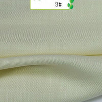 A close-up of Longan Craft’s Colorful Twill 100 Lyocell Fabric By The Yard reveals its smooth, sustainable lyocell material with fine diagonal lines and soft folds—ideal for comfortable, beautifully textured suits.