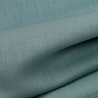 A close-up of Longan Craft’s Colorful Twill Lyocell Fabric by the yard, made from 100% lyocell, featuring a fine textured weave with soft folds and subtle shadows—a sustainable, comfortable material ideal for suits.