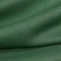 Close-up of dark green Colorful Twill Lyocell Fabric by Longan Craft, showing ribbed 100% lyocell texture with diagonal folds that create shadows and highlights across this sustainable material, perfect for suits.