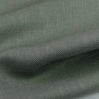 A close-up of Longan Craft’s Colorful Twill Lyocell Fabric By The Yard shows its grey, sustainable 100% lyocell weave and soft folds, highlighting the comfortable texture ideal for suits.