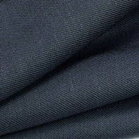 Close-up of folded dark gray Colorful Twill Lyocell Fabric By The Yard from Longan Craft, showing fine ribbed texture and diagonal folds. This 100% lyocell material is eco-friendly, soft, slightly stretchy, and perfect for comfortable suits.
