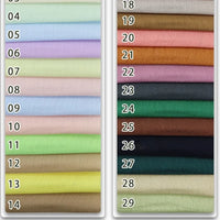 Stacked rows of Longan Craft's Colorful Viscose Challis Fabric By The Yard, labeled 04–29, show an array of lighter to darker hues. This lightweight, breathable polyester viscose is ideal for sun protection shirts and creative sewing projects.