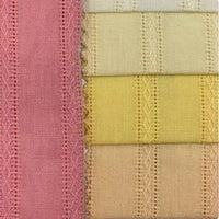 Five pieces of Longan Craft's Colorful Viscose Dobby Fabric—a cotton-rayon blend with jacquard patterns—are stacked in pastel shades, each showing a soft textured finish, perfect for DIY dresses.