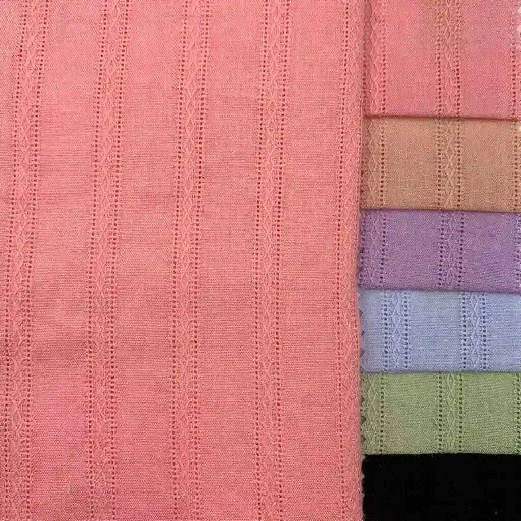Seven pieces of Longan Craft Colorful Viscose Dobby Fabric by the yard are stacked on the right, with a larger pink panel on the left. All cotton-rayon blend fabrics show subtle vertical stripes with jacquard patterns and openwork details.