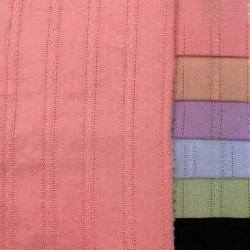 Seven pieces of Longan Craft Colorful Viscose Dobby Fabric by the yard are stacked on the right, with a larger pink panel on the left. All cotton-rayon blend fabrics show subtle vertical stripes with jacquard patterns and openwork details.