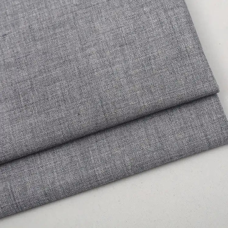 A folded piece of Colorful Worsted Wool Fabric By The Yard, featuring a fine, woven texture.