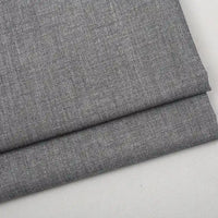 A folded piece of Colorful Worsted Wool Fabric By The Yard, featuring premium multicolor wool with a fine weave.