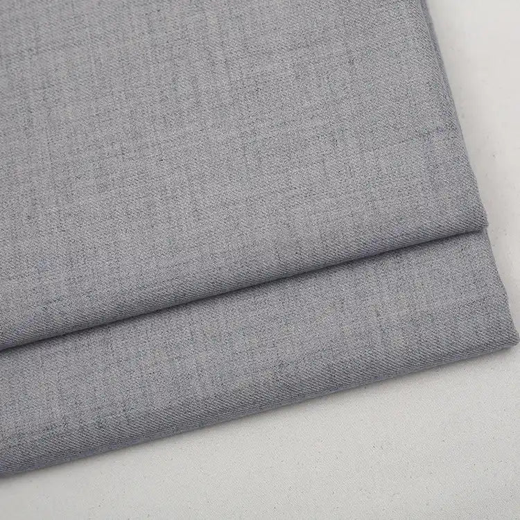 Folded light gray Colorful Worsted Wool Fabric By The Yard with a subtle woven texture.