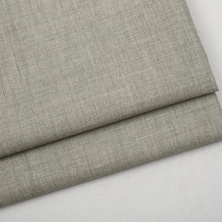 A folded length of light gray Colorful Worsted Wool Fabric By The Yard, featuring premium wool with a subtle textured finish.