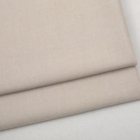 Folded light beige Colorful Worsted Wool Fabric By The Yard with a tight woven texture.