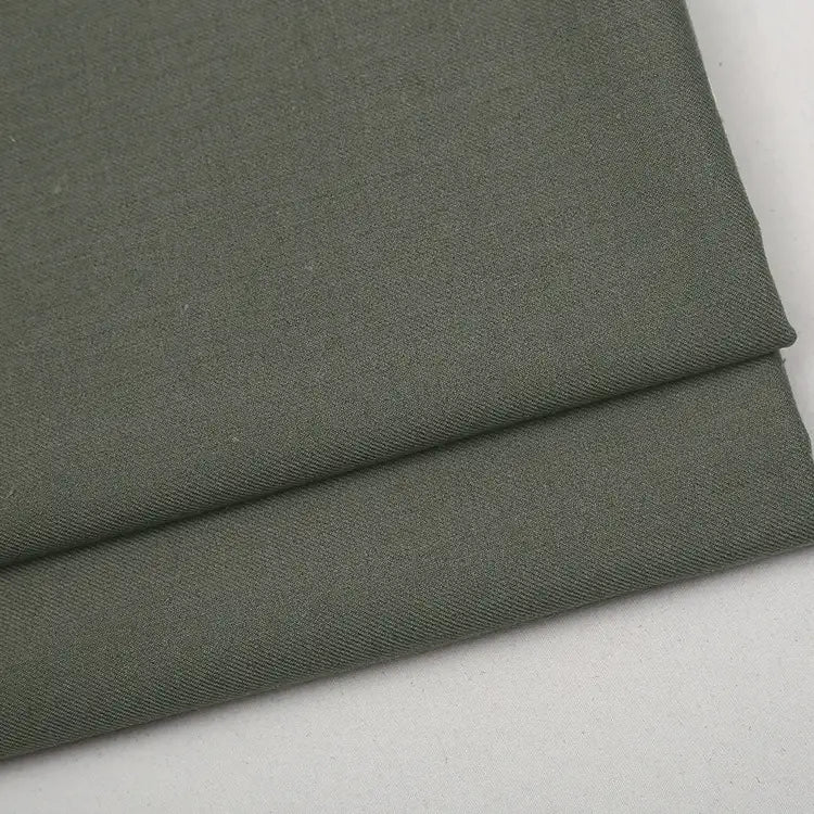 A folded piece of olive-green Colorful Worsted Wool Fabric By The Yard in premium worsted wool.