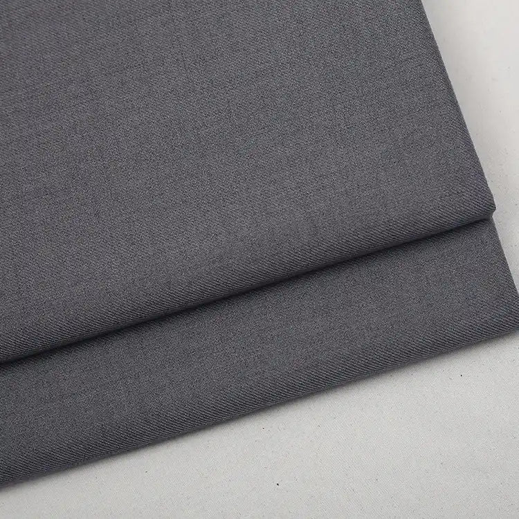 Folded piece of dark gray Colorful Worsted Wool Fabric By The Yard with a woven texture.