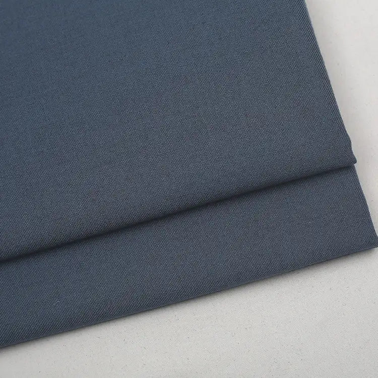 A folded swatch of dark blue Colorful Worsted Wool Fabric By The Yard.