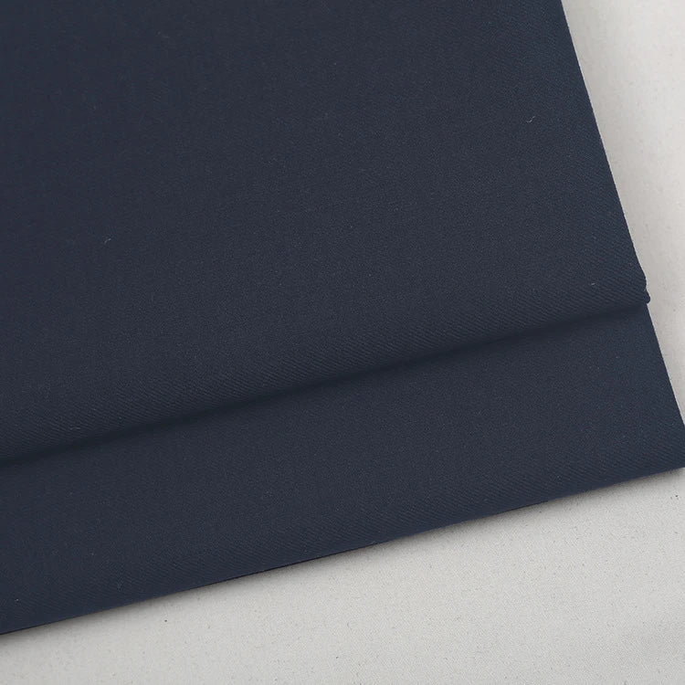 Folded piece of dark blue Colorful Worsted Wool Fabric By The Yard in a premium worsted wool.