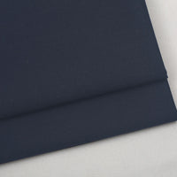 Folded piece of dark blue Colorful Worsted Wool Fabric By The Yard in a premium worsted wool.