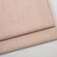 Folded piece of light pink Colorful Worsted Wool Fabric By The Yard, made of premium worsted wool.