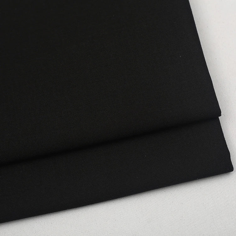 A folded piece of Colorful Worsted Wool Fabric By The Yard in solid black.