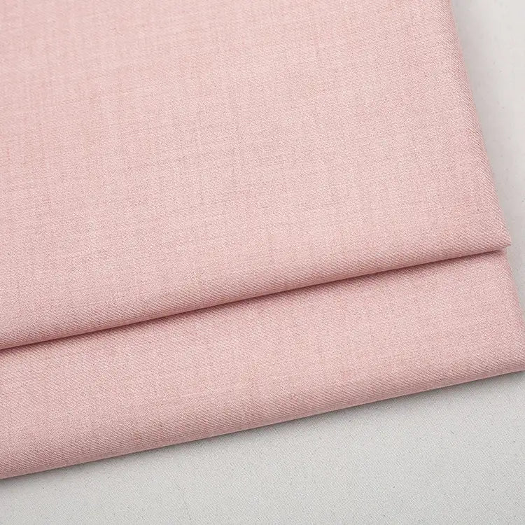 Folded piece of light pink Colorful Worsted Wool Fabric By The Yard in a premium worsted wool blend.