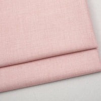 Folded piece of light pink Colorful Worsted Wool Fabric By The Yard in a premium worsted wool blend.