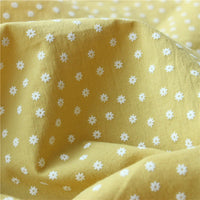 Close-up of Longan Craft’s Cotton Floral Printed Voile Fabric By The Yard shows a soft, breathable voile with a multicolor washed flower print. This cozy material features gentle folds and texture, ideal for casual wear.