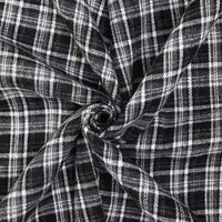 Longan Craft’s Cotton Gingham Sueded Flannel Fabric by the Yard is displayed here in a twisted spiral, showcasing its intersecting multicolor checked pattern and comfy, textured flannel material.