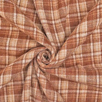 Longan Craft’s Cotton Gingham Sueded Flannel Fabric by the Yard, a multicolor polyester checked flannel with a comfy sueded texture, is shown gathered and twisted into a spiral shape at the center.