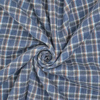Longan Craft’s Cotton Gingham Sueded Flannel Fabric By The Yard features a spiral pattern of multicolor polyester checked flannel—blue, gray, and white tones—creating radiating folds and wrinkles for a comfy shirting material.