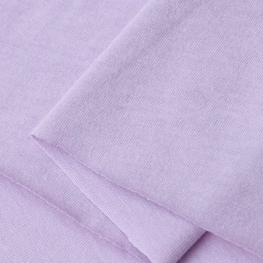 A close-up of Longan Craft’s Cotton Jersey Fabric By The Yard reveals its soft, smooth, and breathable texture—ideal colorful single jersey material for making casual wear.