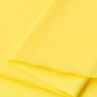 A close-up of Longan Craft Cotton Jersey Fabric by the Yard in bright yellow, highlighting its soft, smooth, and breathable single jersey texture—ideal for making casual wear.