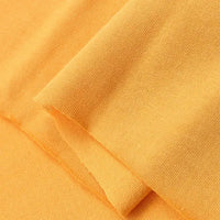 Close-up of Longan Craft Cotton Jersey Fabric By The Yard in a soft, light orange shade, highlighting its smooth texture and fine knit—ideal colorful single jersey material for casual wear.