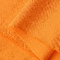Close-up of Longan Craft's Cotton Jersey Fabric By The Yard in orange, revealing its soft, finely woven texture. This colorful single jersey material is smooth, breathable, and ideal for making casual wear.
