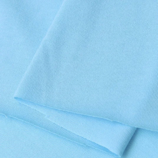 Close-up of Longan Craft’s Cotton Jersey Fabric By The Yard—light blue, soft, breathable single jersey material with a fine knit pattern—ideal for casual wear and crafts.